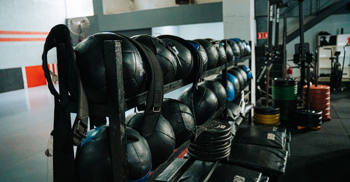 Well-equipped indoor gym featuring kettlebells, weights, and workout gear, perfect for fitness enthusiasts.